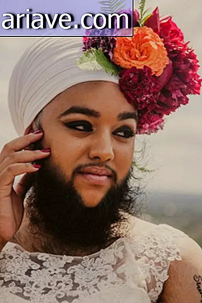 Breaking Taboo: Femme pose en robe de mariée avec des fleurs à la barbe