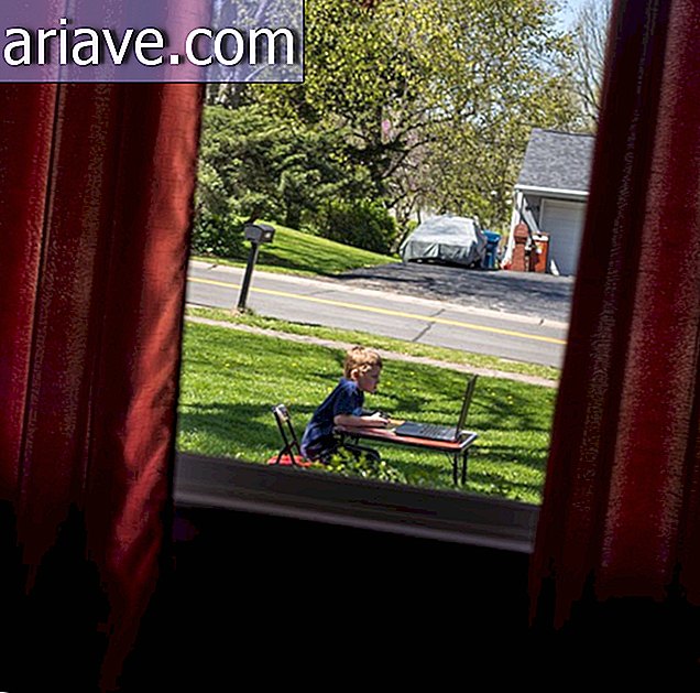 Boy playing outside the house