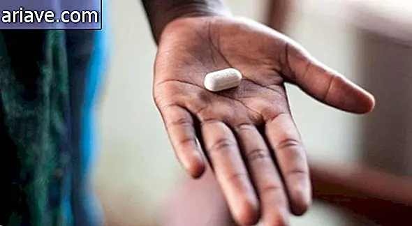 Hand holding pill