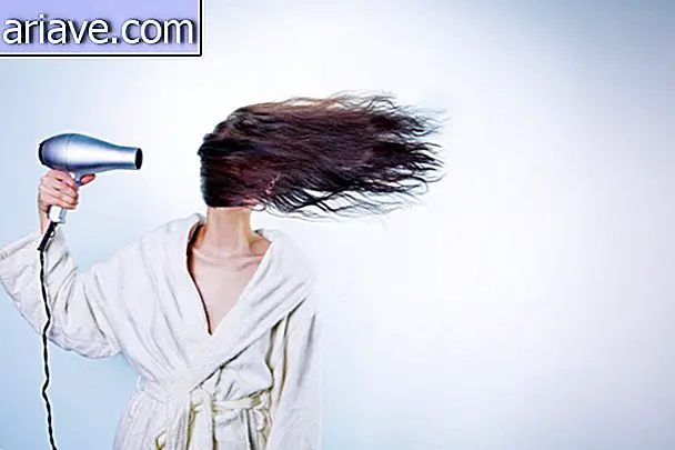 Woman with hair dryer